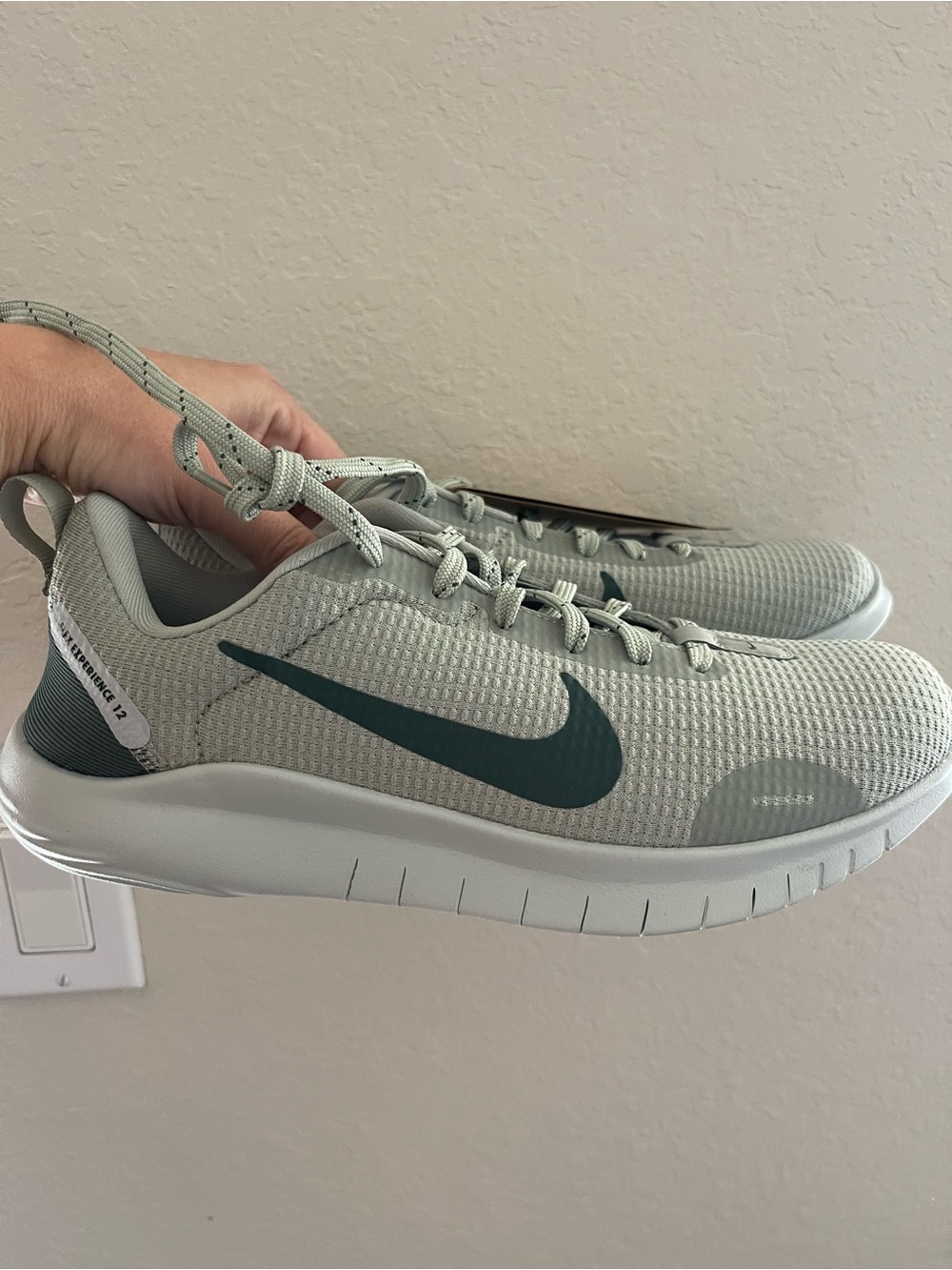 Nike Women’s Light Green Athletic Sneakers with Teal Swoosh